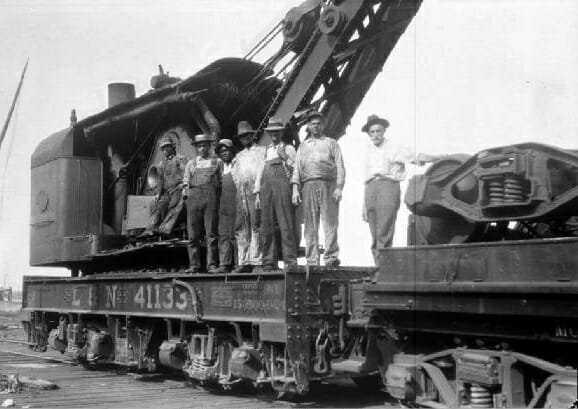 L&N Railroad wrecking crew on a steam crane in Mobile, Alabama, circa 1935