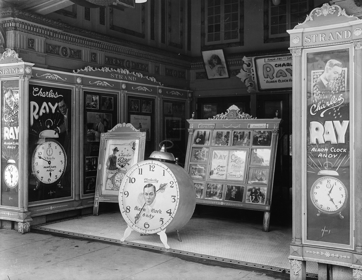 Strand Theatre advertising alarm clock for Amos and Andy show, 1920