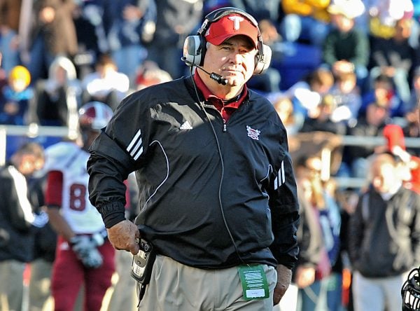Head coach Larry Blakeney standing at a Troy University football game