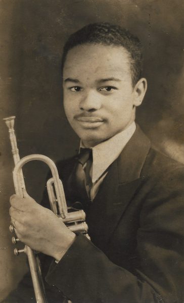 archival photograph of Sammy Lowe with instrument