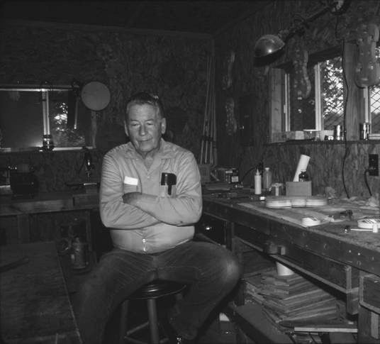 Gene Ivey sitting at workshop