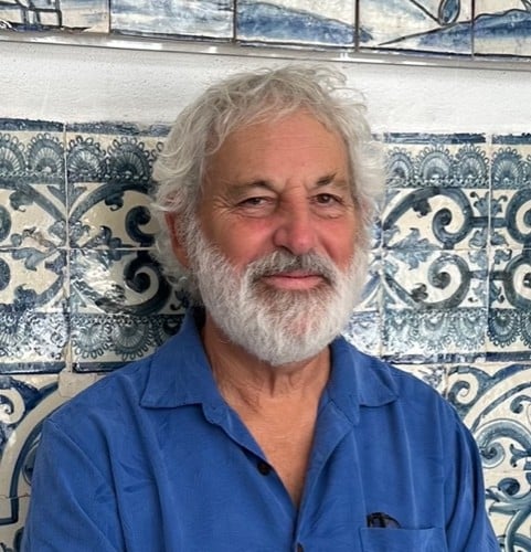 Roy Hoffman in front of tile wall
