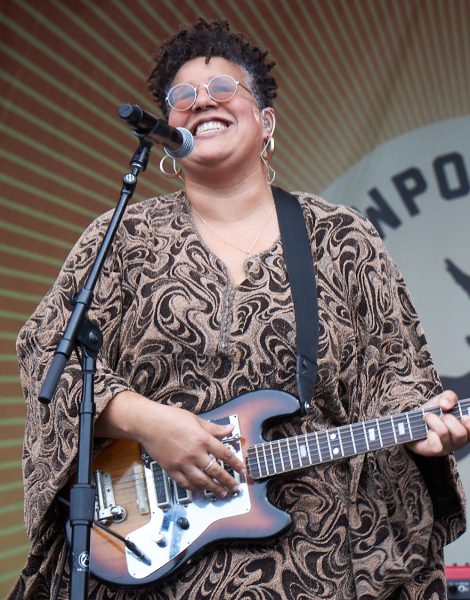 Brittany Howard performs onstage with an electric guitar